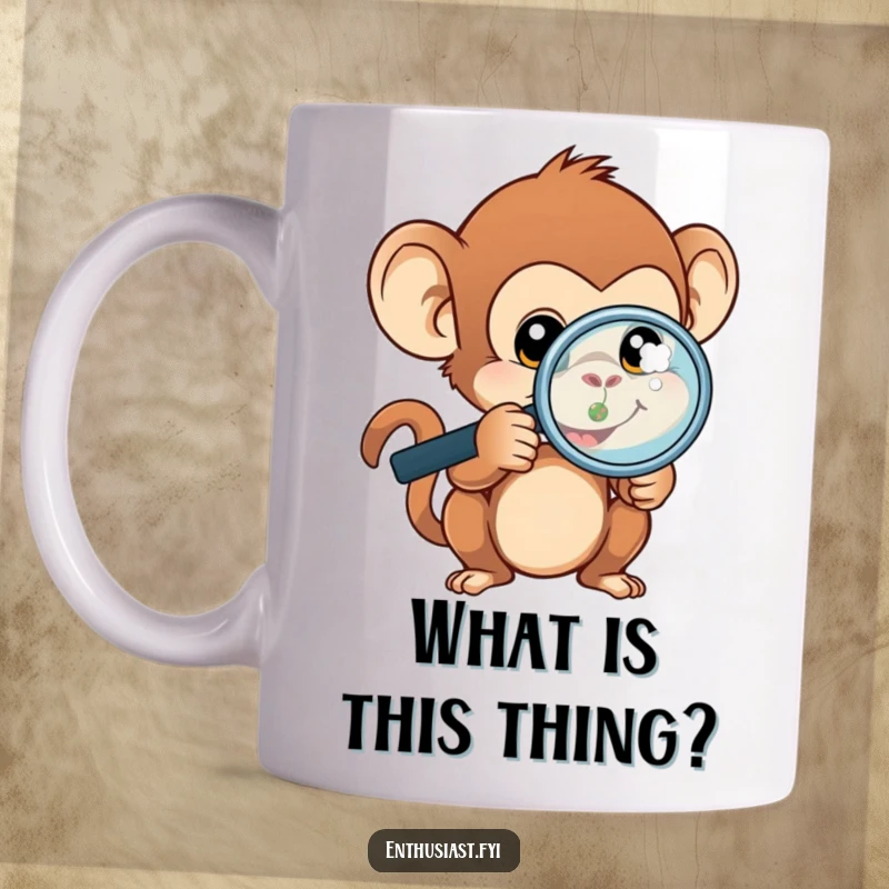 Funny monkey mug featuring a curious monkey wearing a magnifying glass, intently examining a small, detailed object.