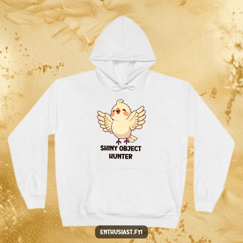 Funny bird hoodie featuring a delighted bird in mid-air, wings wide, swooping down towards a shiny object with gleeful intent.