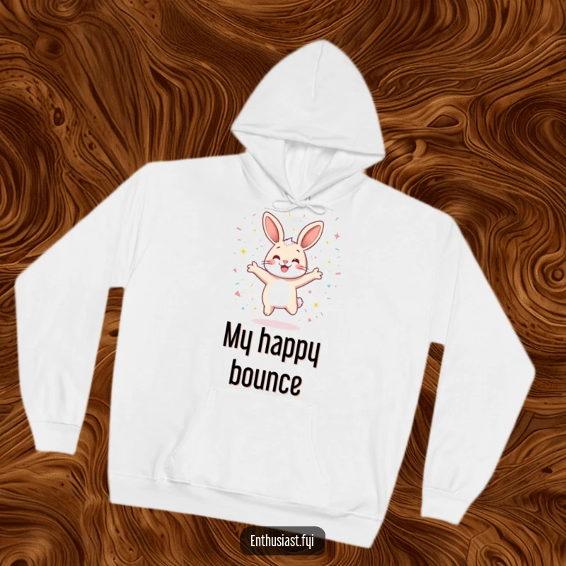 Funny hoodie showcasing a playful rabbit character jumping exuberantly amidst a shower of sparkling confetti, radiating happiness and fun.