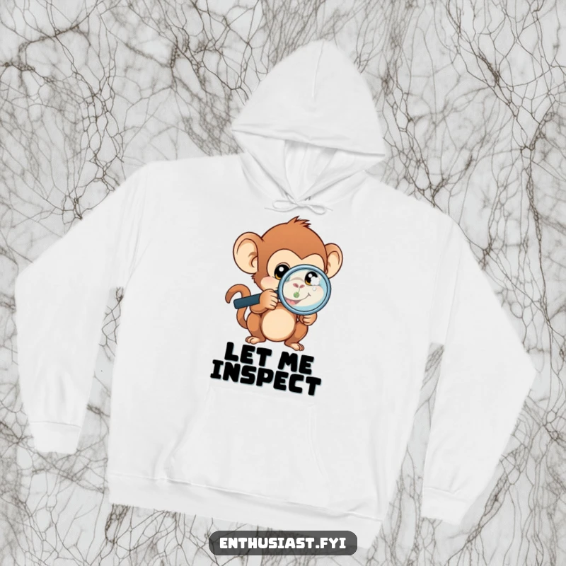 Funny monkey hoodie featuring a curious monkey with a magnifying glass, zoomed in on a tiny, complex object.