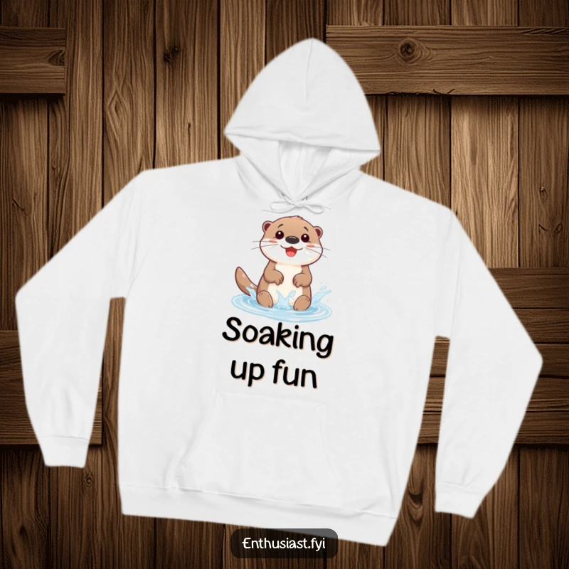 Funny hoodie depicting a happy otter character gleefully splashing in a small, sparkling puddle, radiating cheerful water fun.