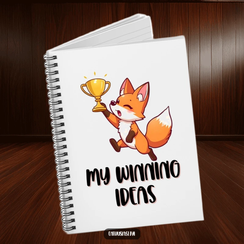 Funny notebook featuring an energetic fox character in a playful leap, aiming for a shimmering golden trophy. Inspires ambition.
