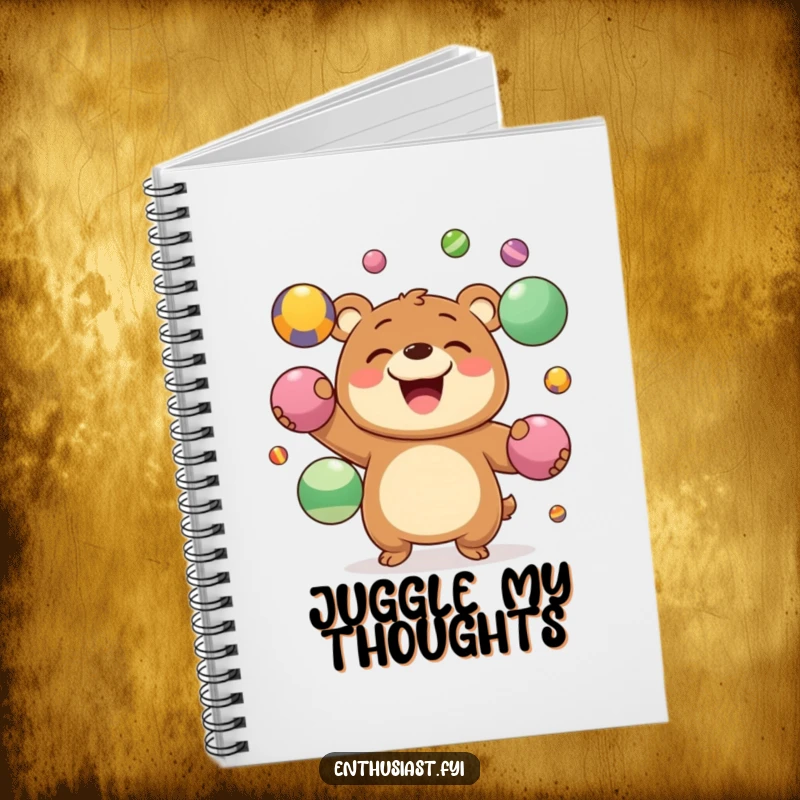 Funny Notebook with a joyous bear character grinning while juggling colorful balls, ideal for a humorous multitasker.