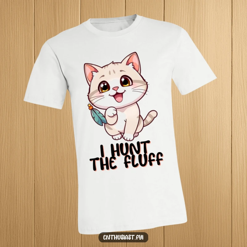 Funny cat t-shirt depicting a cheerful cat with wide eyes, gleefully batting at a dangling feathered toy, capturing playful mischief.