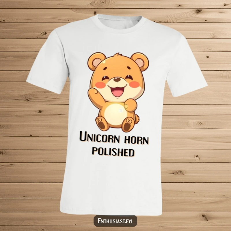 Funny bear t-shirt depicting a joyful bear character with a wide grin, proudly holding up a luminous, imaginary glowing object.