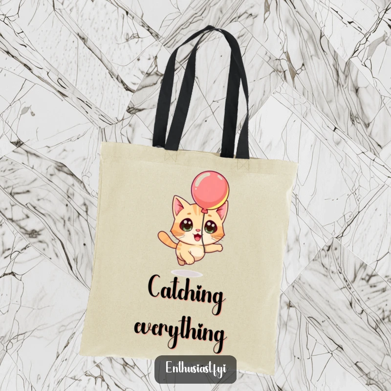 Funny tote bag with a curious cat character chasing a floating balloon, ideal for carrying essentials with feline flair.